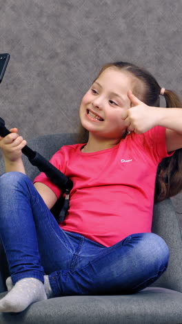 beauty child taking selfie. portrait of excited little girl taking selfie