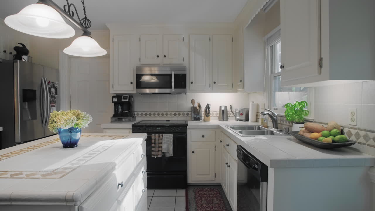 Gimbal shot of and empty white kitchen in the suburbs