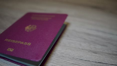 german passport lies on a wooden table