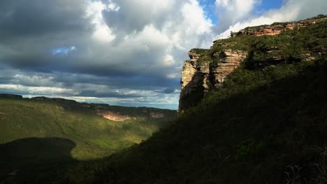 tilting down shot of a large plateau cliff from the bottom of the mount of pai inácio hike in the chapada diamantina national park in northern brazil on a warm summer evening