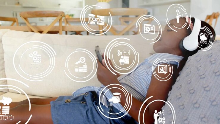 Girl reclining sofa holding phone, graphic appearing pulsing into white icons for tech demo