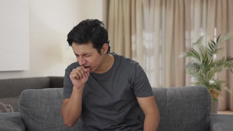 sick indian man suffering from cold and cough