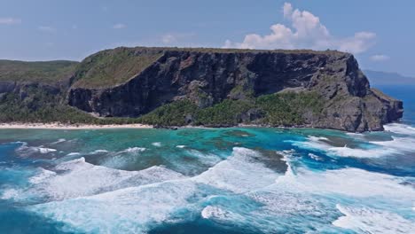 Drone-pan-view-of-Fronton-beach-and-white-foams-in-Las-Galeras-Samana,-Dominian-Republic