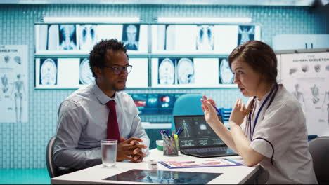 general practitioner consults patient about diagnostic test results