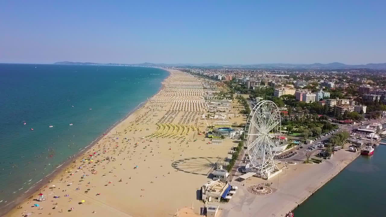 Aerial View Of The Famous Resort And Ferris Wheel In Rimini, Italy - drone shot