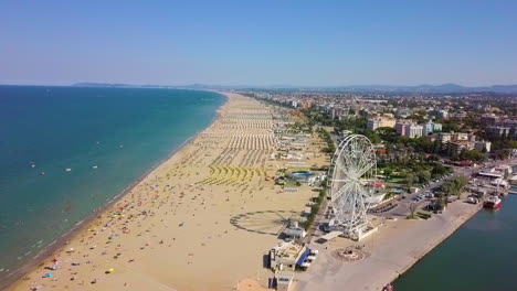 aerial view of the famous resort and ferris wheel in rimini, italy - drone shot