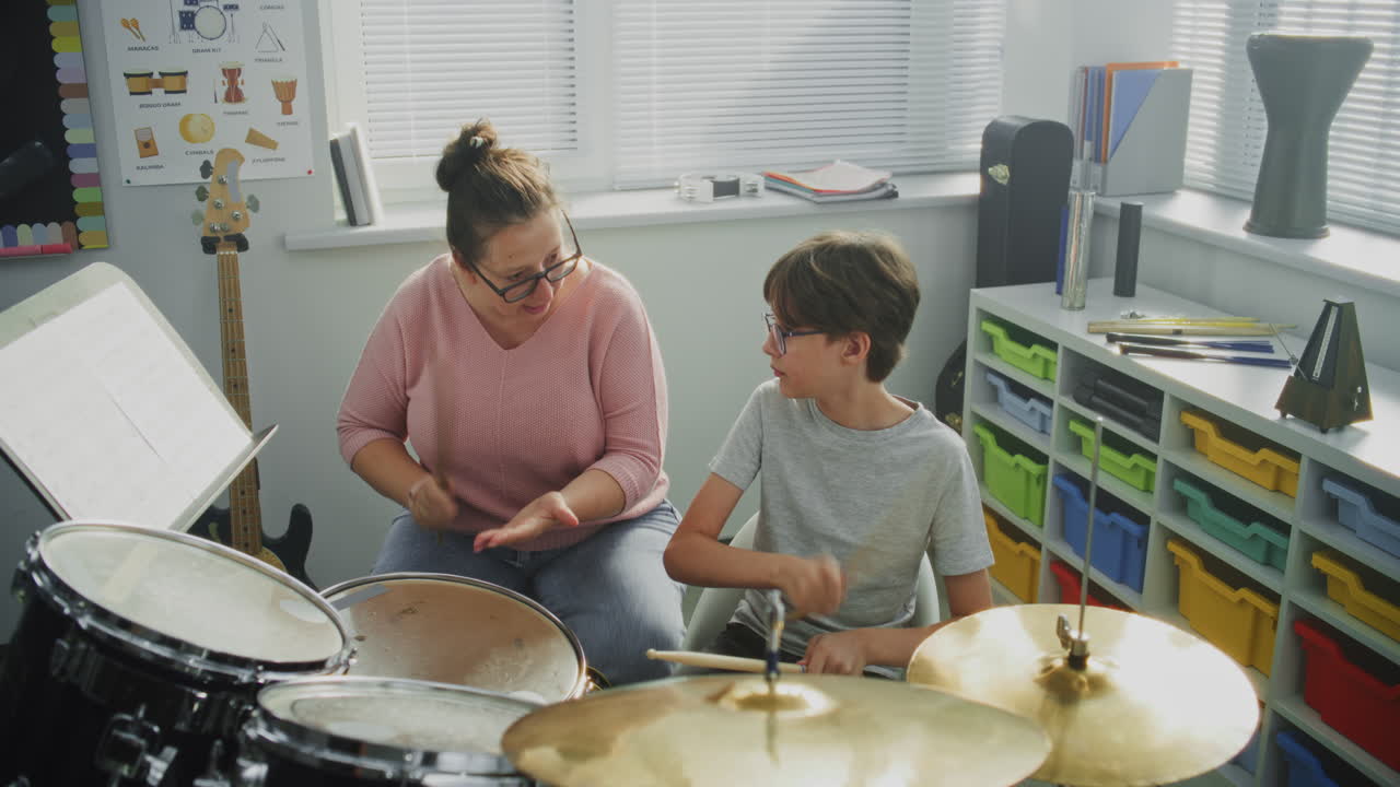 Talented Boy Playing Drums Teacher Teaching Young Musician to Play Drum Kit on Music Lesson