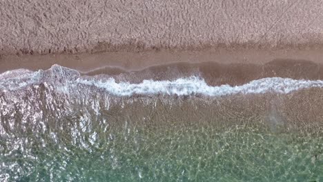 aerial view of a beach and waves