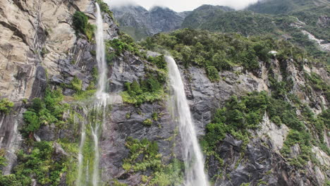 majestic misty waterfalls cascade down steep rocky cliffs