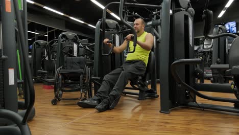 man with disabilities training in the gym of rehabilitation center