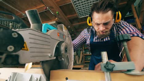 craftsman is cutting wood with a circular saw