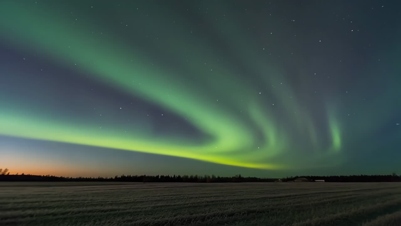 Stunning Aurora Borealis over a tranquil field at night