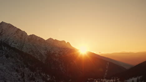 picturesque warm sunset over italian alps in wintertime