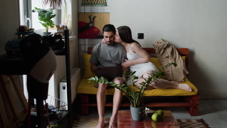 Couple-sitting-on-the-sofa-at-home