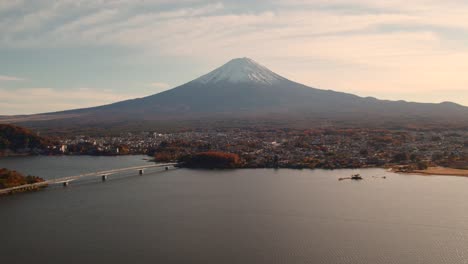 a panning drone shot of mount fuji in kawaguchiko, japan during the autumn season