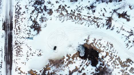 Aerial-top-down-view-of-an-ATV-drifting-offroad