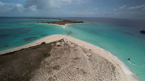 a serene island surrounded by turquoise waters in los roques, venezuela, aerial view