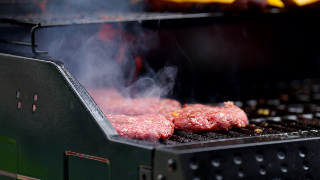 Juicy Beef Burger Patty In A Griller. Slow Motion Shot