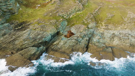 aerial view of a shipwreck on a rocky coast