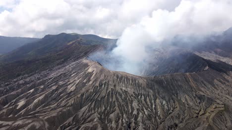 The awe of Mount Bromo's volcanic activity – a natural spectacle of billowing smoke and fiery eruptions in East Java, Indonesia
