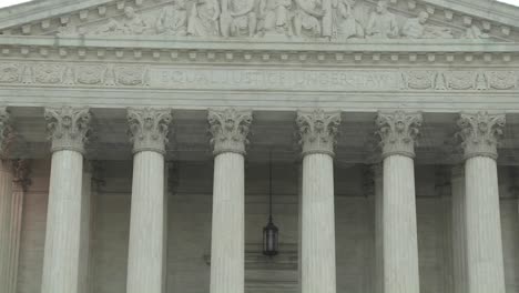 a zoom back from the equal justice under law sign at the supreme court building in washington dc