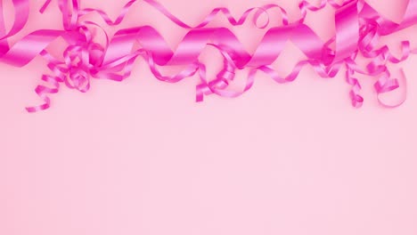 woman hands put gift under pink ribbons on pink theme. stop motion birthday celebration