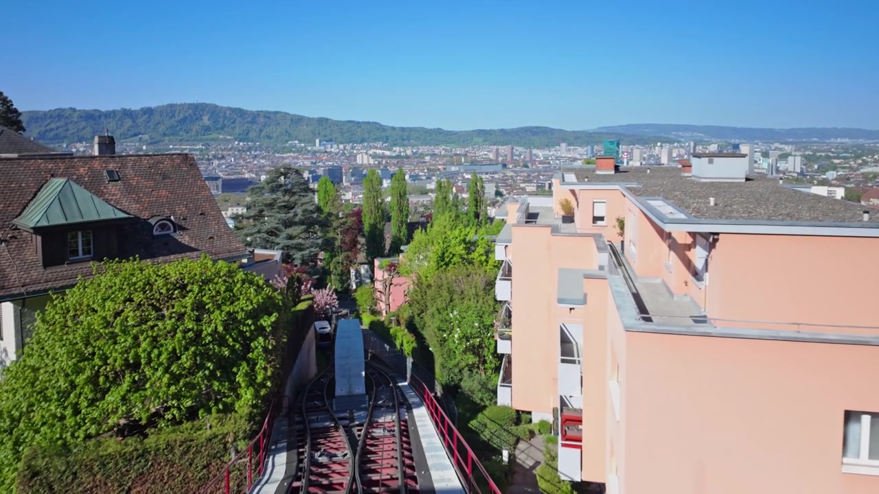 The cabin Funicular climbs up to Rigiblick - Zurichberg. The city of Zurich is visible in the background.