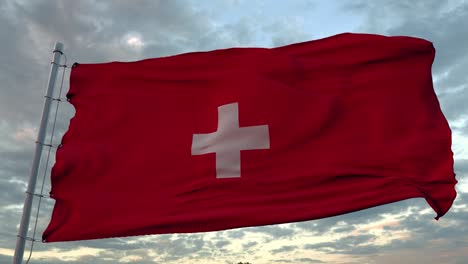 la bandera nacional de suiza ondea en el viento contra un cielo azul