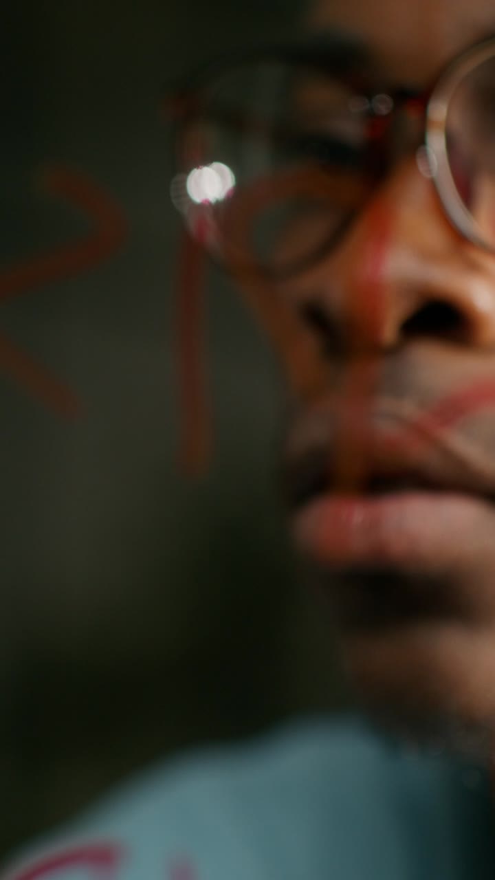 Close-up portrait of a person wearing glasses