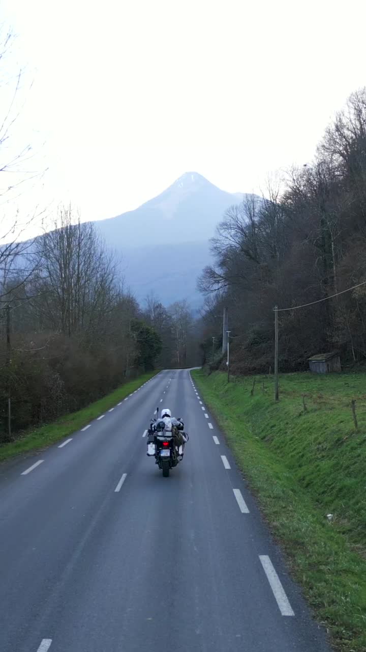 Motorcycle ride on a scenic road with a mountain view