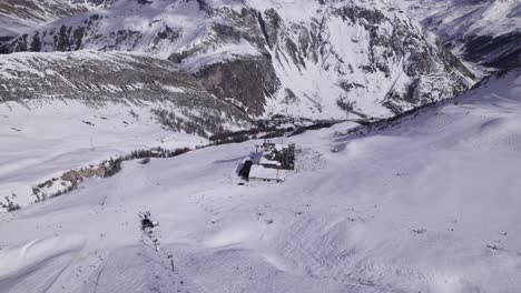 aerial view of ski slope in the french alps with chairlifts- dolly in shot - shot in tignes and val d'isere