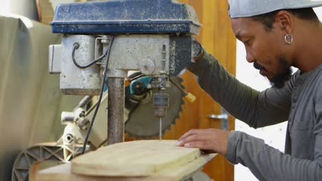 man using radial drill machine 4k