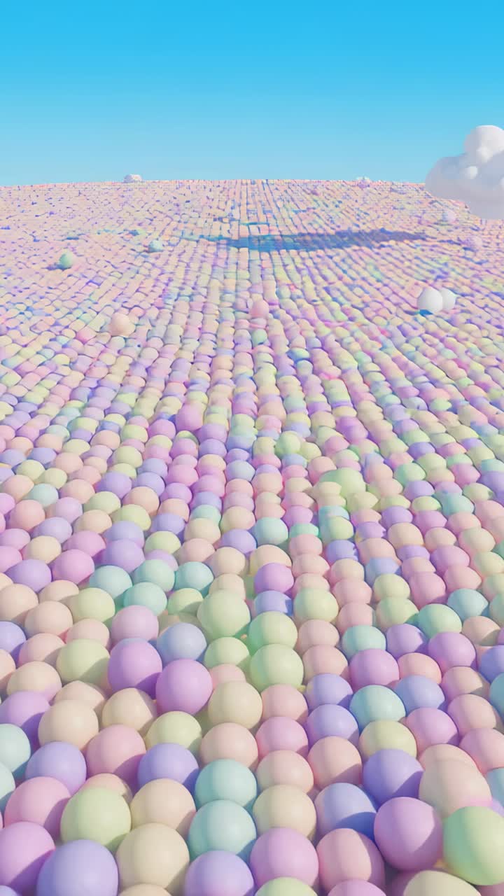 Video verticale: camera che scivola mostrando sfere pastello in un campo aperto, con ombre e nuvole in movimento