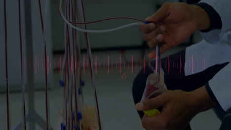holding medical tubing, person with heartbeat animation over medical equipment