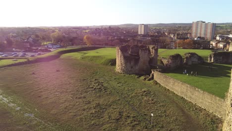 Ancient-Flint-castle-medieval-heritage-military-Welsh-ruins-aerial-view-landmark-close-right-pan