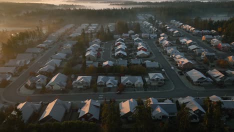 aerial view of houses covered in a layer of frost during a cold winter morning