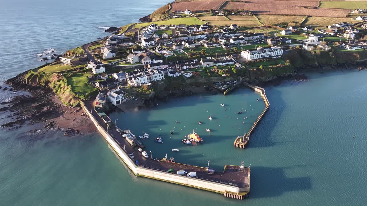 Drone video of Ballycotton Pier in Ballycotton Cork Ireland - showing the Pier, Atlantic ocean and boats