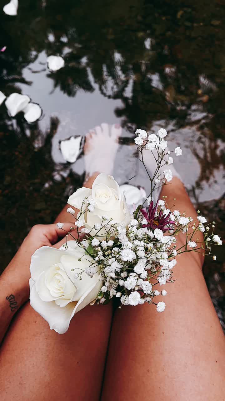 Woman with Flowers in a Stream