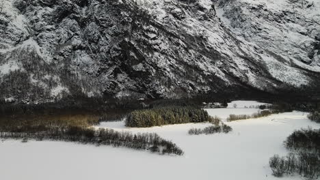 Snow-Covered-Landscape-At-The-Foot-Of-The-Alpine-Mountain-During-Winter-Season-In-Norway