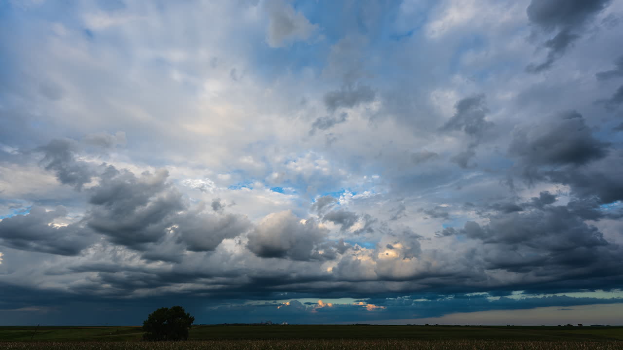Beautiful clouds gently drifting by calming evening scene