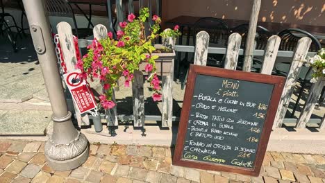 chalkboard menu with flowers in cuneo, italy