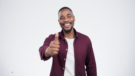 Smile,-face-and-black-man-with-thumbs-up-in-studio