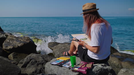 artist painting on the beach