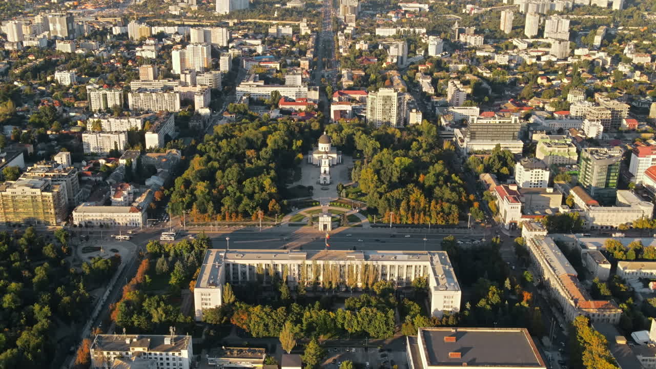 Aerial drone view of Chisinau downtown at sunset. Panorama view of Central Park, Cathedral, Goverment a lot of greenery, buildings. Moldova