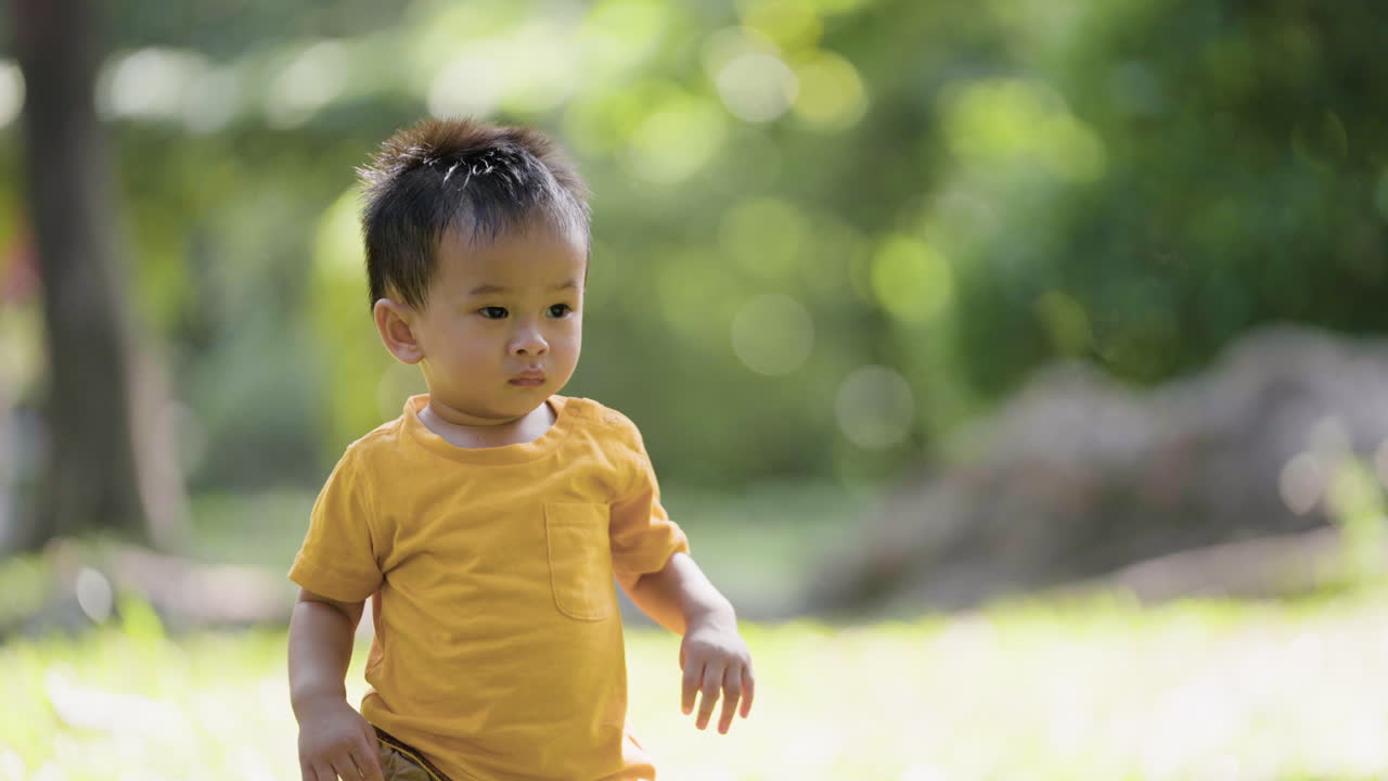 Little asian kid outdoors