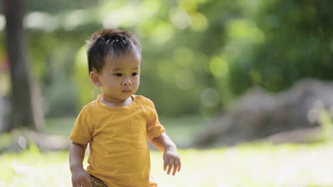 little asian kid outdoors