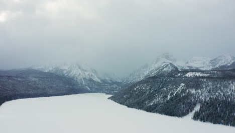 aerial drone footage of frozen winter lake