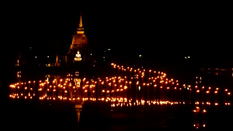 light in buddha statue at temple in loy kratong festival, sukhothai historical park , thailand