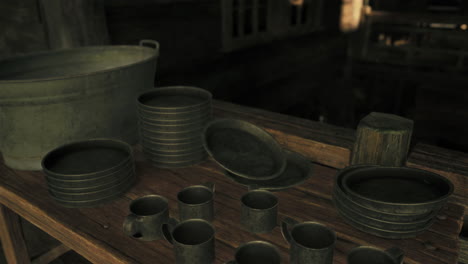 old rustic kitchen with metalware on wooden table