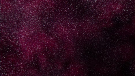 universo con polvo volador y nubes rojas